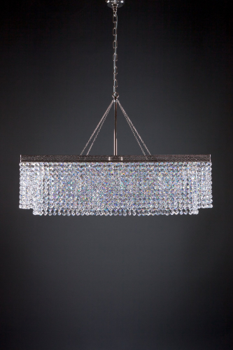 A glorious modern sparkling crystal chandelier creates an atmosphere, a ceiling lamp for every home, a table lamp and a general lamp.